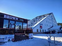 Kapriz Karakol Hotel directly on the slope with ski-in ski-out access